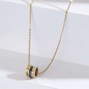 Gold plated stainless steel 3 ring charm necklace